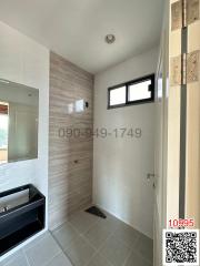 Modern bathroom with walk-in shower and stylish tiling