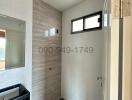 Modern bathroom with walk-in shower and stylish tiling