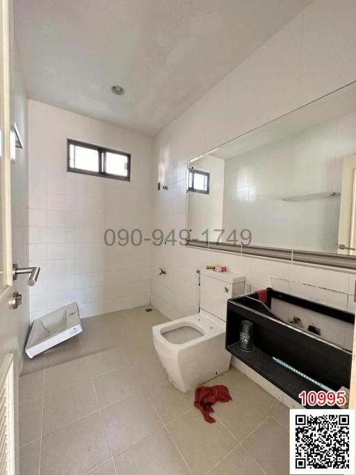 Modern bathroom interior with natural light and tiled floor