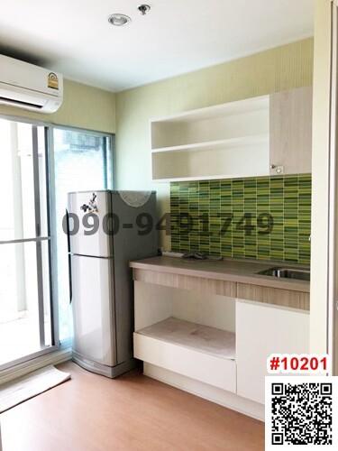 Compact kitchen area with modern appliances and green tile backsplash