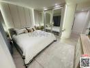 Spacious bedroom with large bed, mirrored wardrobe, and modern lighting