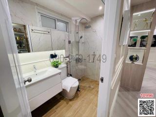 Modern bathroom with marble walls and premium fixtures