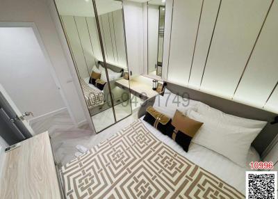 Modern bedroom interior with mirrored wardrobe and elegant decor