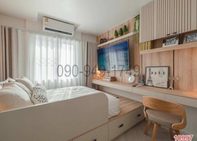 Modern bedroom with ample storage and entertainment unit