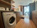 Modern kitchen with wooden cabinets and washing machine