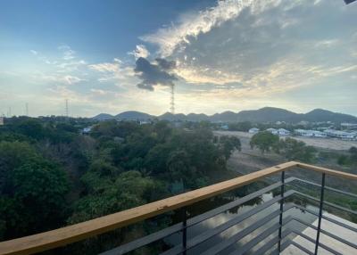 Spacious balcony with a scenic view of hills and natural landscapes