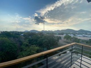 Spacious balcony with a scenic view of hills and natural landscapes