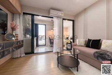 Modern living room interior with comfortable sofa and glass door leading to a balcony