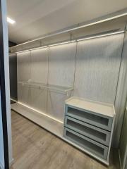 Modern built-in closet with LED lighting and shelves