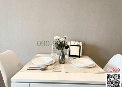 Elegantly set table in a modern dining area with neutral color scheme