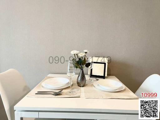 Elegantly set table in a modern dining area with neutral color scheme