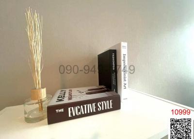 Modern minimalist living room details with decorative books and vase