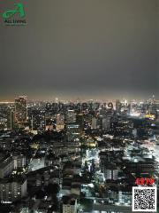 High-rise cityscape at night with illuminated buildings