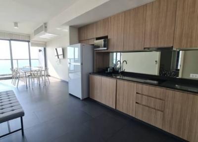 Modern kitchen with integrated dining area and ocean view