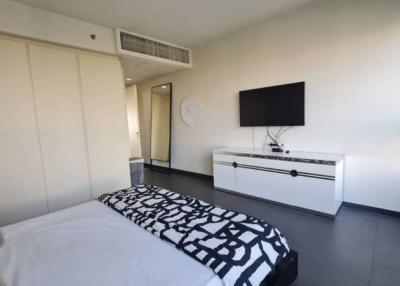 Modern Bedroom with Double Bed and Wall-Mounted Television