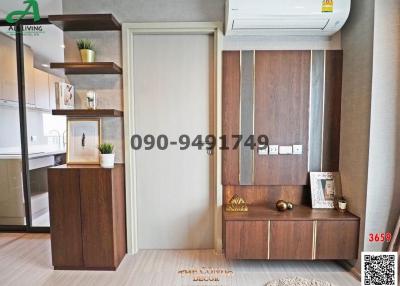Modern living room with wood-toned cabinetry and air conditioning
