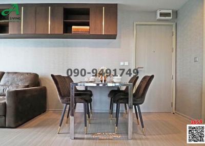 Modern dining area with glass table and comfortable seating