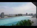 Luxurious rooftop swimming pool with city skyline view