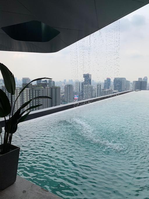 Modern infinity pool balcony overlooking the city skyline