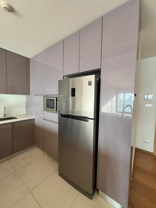 Modern kitchen with stainless steel appliances and wooden cabinets