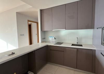 Modern kitchen with L-shaped countertop and built-in appliances