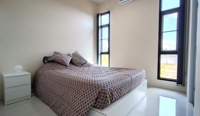 Modern bedroom with natural light and stylish decor