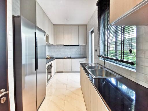 Modern kitchen with stainless steel appliances and white cabinets