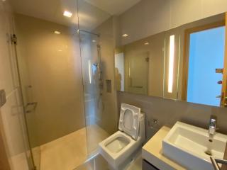 Modern Bathroom with Glass Shower and Vanity Mirror