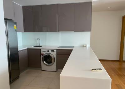 Modern kitchen with stainless steel appliances and white countertops