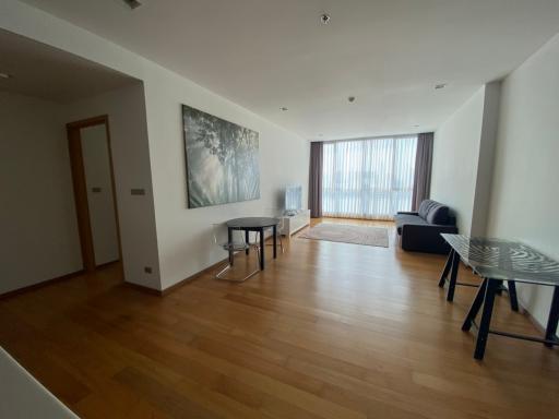 Spacious living room with hardwood flooring and modern furniture