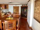 Spacious dining room with wooden furniture and decorative artwork