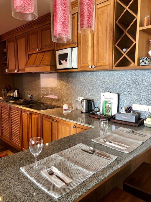 Cozy kitchen with wooden cabinets and modern appliances