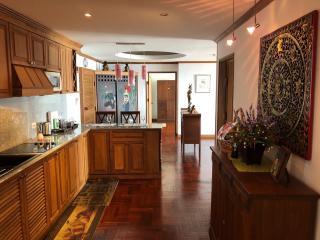 Spacious kitchen with wooden cabinets and hardwood floors