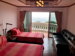 Bright bedroom with sea view and balcony access