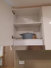 Kitchen cabinet with pots and dishes