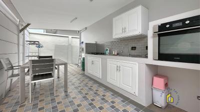 Modern kitchen with mosaic tiled floor and built-in appliances