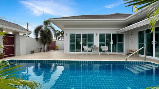 Modern home exterior with swimming pool and patio area