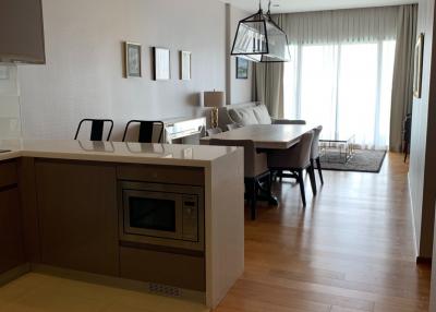 Modern kitchen with open floor plan leading to the dining area