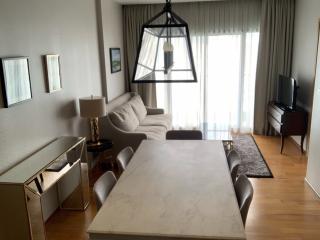 Elegant living room with modern furniture and abundant natural light