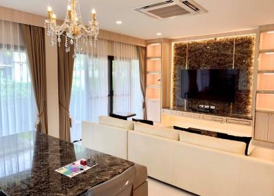 Elegant living room with chandelier lighting and modern furnishings