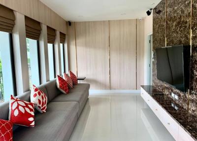 Modern living room with elegant sofa and flat-screen TV
