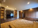 Modern bedroom with large bed and wooden wall paneling