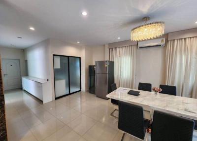 Modern kitchen with dining area and high-end appliances