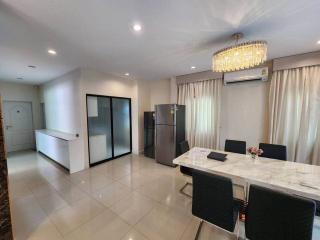 Modern kitchen with dining area and high-end appliances