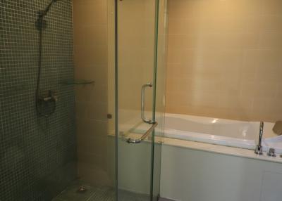 Modern bathroom with glass shower and bathtub