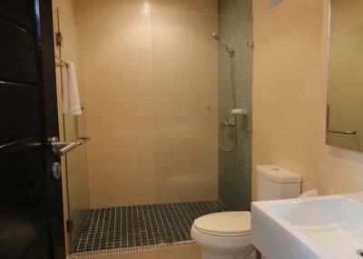 Modern bathroom interior with glass shower area