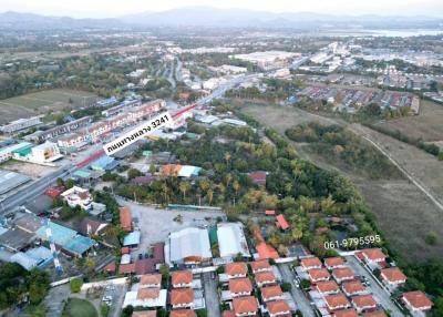 Aerial photo of a suburban development with housing and road infrastructure