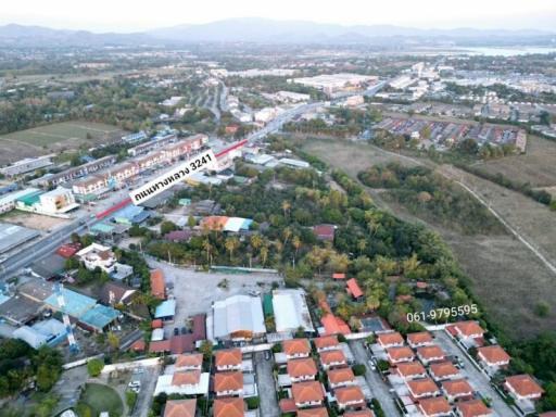 Aerial photo of a suburban development with housing and road infrastructure