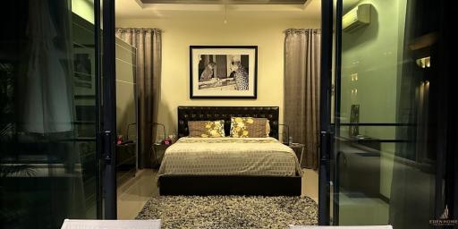 Cozy bedroom interior with modern design and glass doors