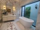 Elegant bathroom with a freestanding bathtub and marble finish